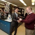Johns Hopkins University President Ronald J. Daniels (left) presents the President's Frontier Award to Scott Bailey.